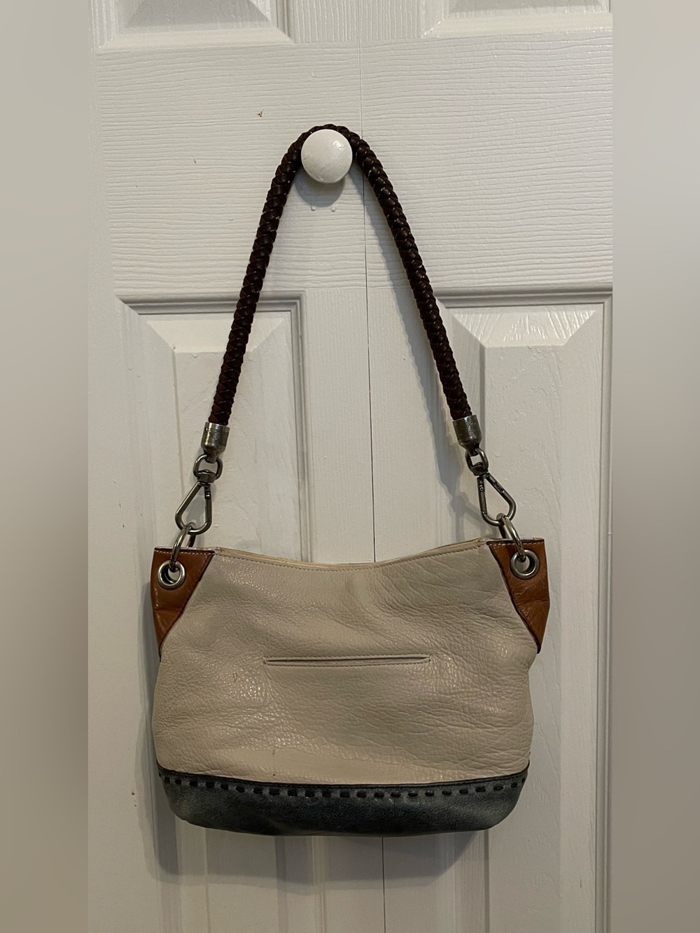 The Sak Cream Shoulder Bag with Brown Accents and Dark Strap